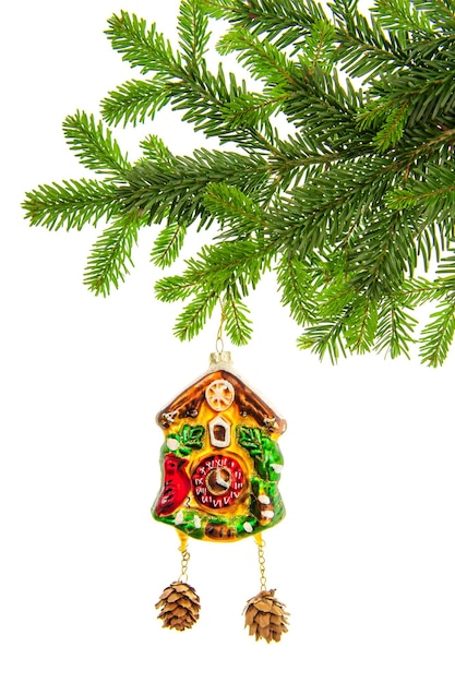 Decorazione natalizia con pallina dell'orologio e ramo di un albero sempreverde