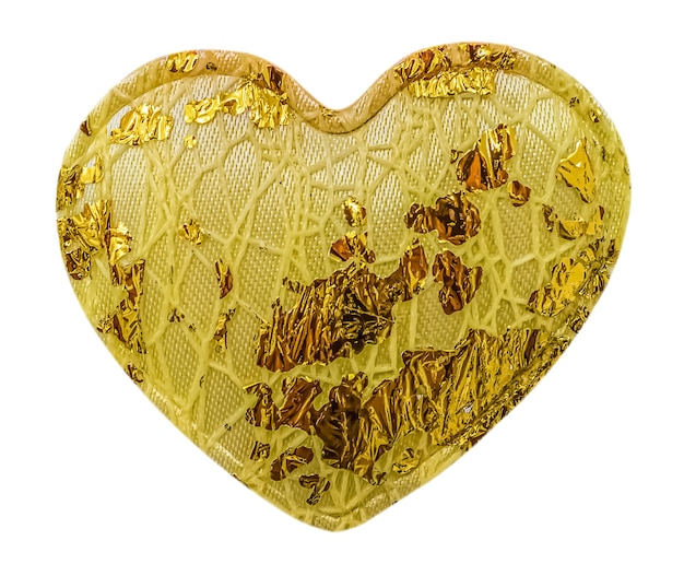 Decorazione tessile cuore giallo con elementi in lamina isolati su sfondo bianco.