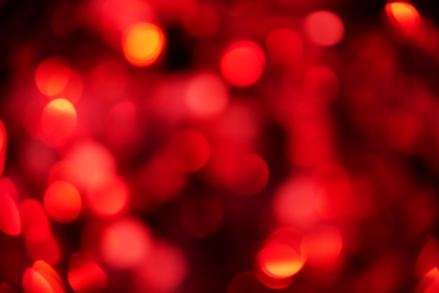 Defocus colore rosso chiaro di natale. Sfondo glitterato, anno nuovo.