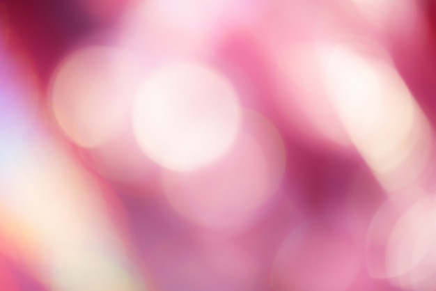 Defocus glitter rosa chiaro e bianco. Fondo astratto della luce del bokeh.