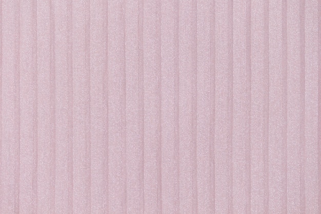 Delicato sfondo rosa, nudo plisse. linee di stoffa geometrica. Tessuto, tessuto da vicino.