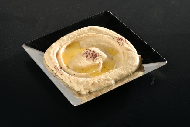 Delizioso hummus con ceci, olio d'oliva, limone e. Concetto di cibo vegetariano.