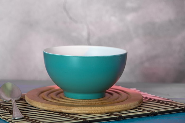Dessert pot on wooden background and illuminated marbled background