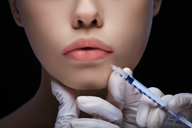 Detailled close up view of a lip injection