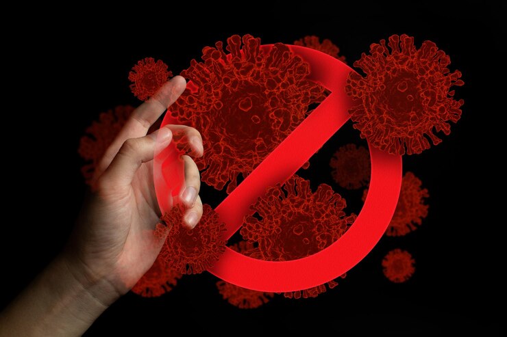 Photo digital composite image of hand with forbidden sign and coronavirus bacterium cells against black background