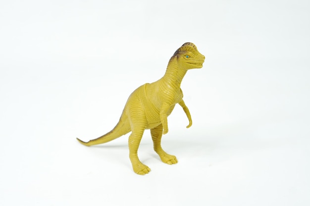 Dinosauro. giocattolo di gomma di plastica isolato su bianco.