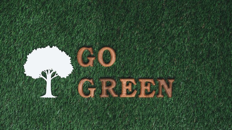Foto diventa verde e salva il mondo con uno sforzo rispettoso dell'ambiente il messaggio go green lettere organizzate per promuovere la consapevolezza ecologica per un futuro sostenibile con un background di progettazione biofila gyre