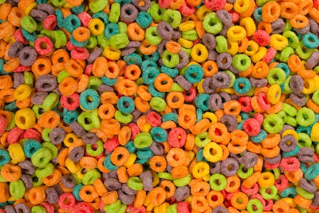 Dolci fiocchi di cereali multicolori come sfondo