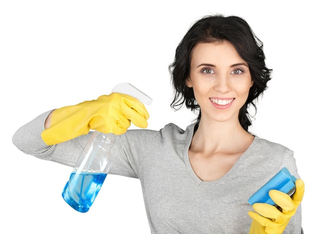 Donna delle pulizie con flacone spray