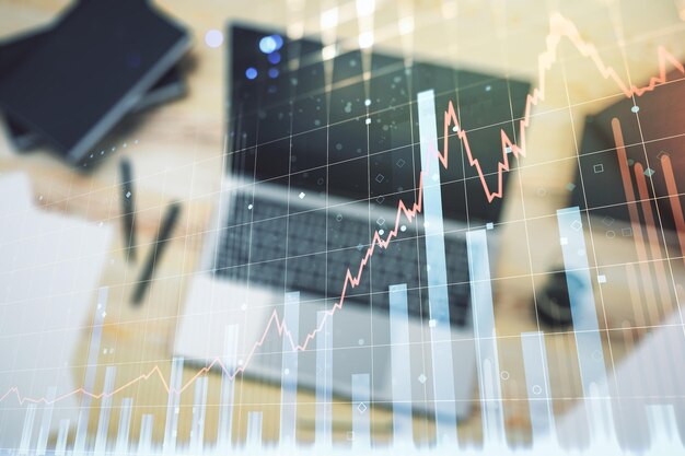 Doppia esposizione del diagramma finanziario creativo astratto sul concetto bancario e contabile moderno del fondo del computer portatile