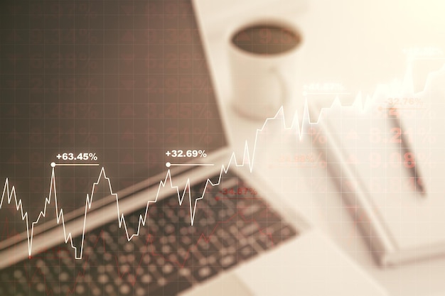 Doppia esposizione del diagramma finanziario creativo astratto sul concetto bancario e contabile moderno del fondo del computer portatile