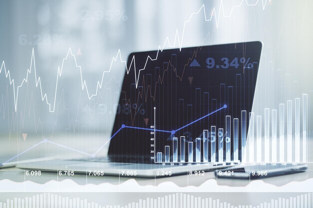 Doppia esposizione del grafico finanziario creativo astratto sul concetto di strategia e ricerca di sfondo del laptop moderno