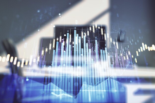 Doppia esposizione di diagramma finanziario creativo astratto e scrivania moderna con computer su sfondo concetto bancario e contabile