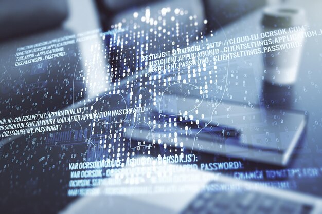 Double exposure of creative code skull hologram on laptop background Malware and cyber crime concept