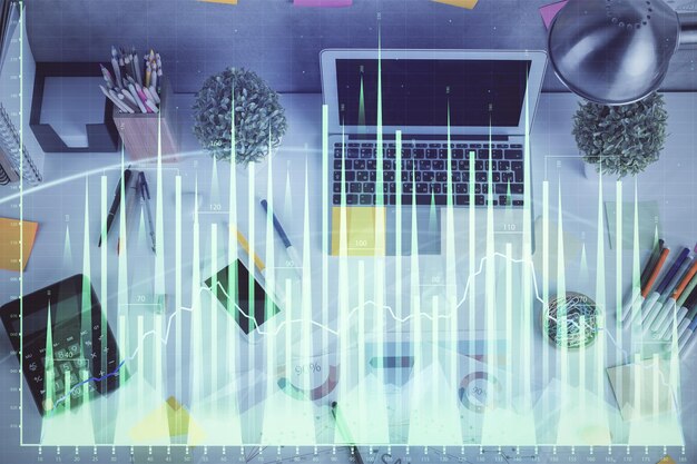 double exposure of forex chart drawing over table background with computer concept of financial research and analysis top view