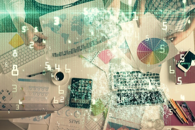 double exposure of man and woman working together and data theme hologram drawing computer background top view