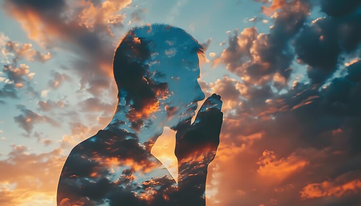Double Exposure of Man Praying Spiritual Connection