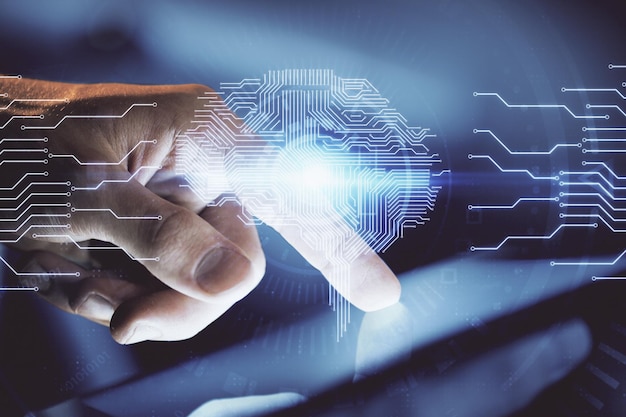 Double exposure of man's hand holding and using a digital device and brain hologram drawing Data concept