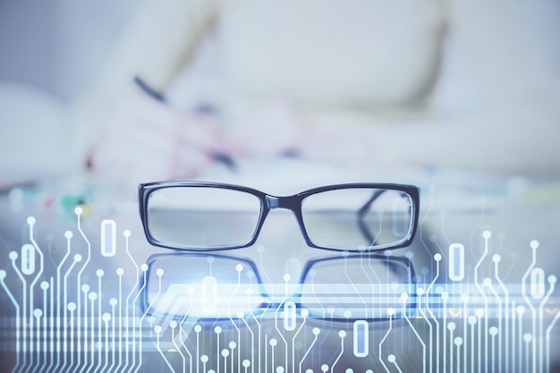 Double exposure of writing hand on background with data solution technology hologram Ai concept