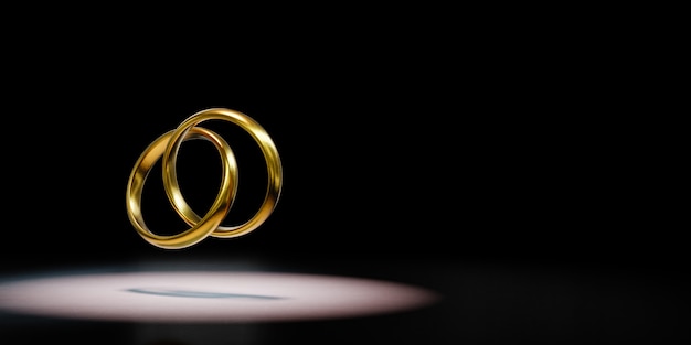 Due anelli dorati incatenati messi in evidenza su fondo nero