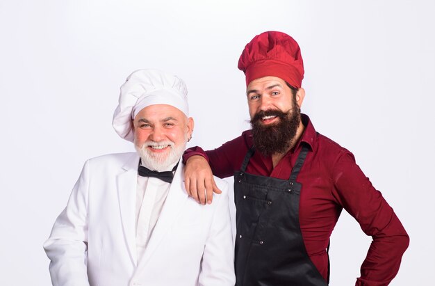 Due chef su chef di cucina in uniforme capo cuoco cibo sano e professionista culinario professionale