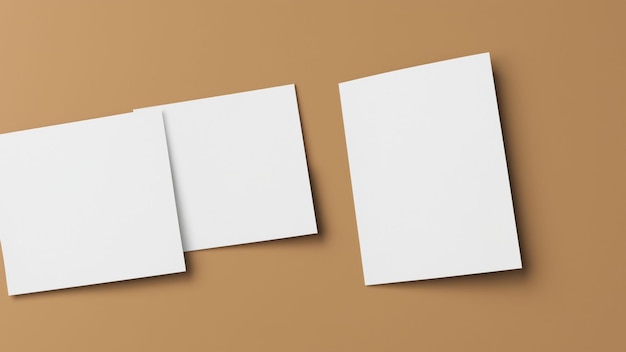 Due pezzi di carta bianchi sono su uno sfondo marrone.