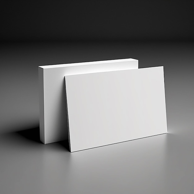 Due piegature di carta bianca si trovano su una superficie grigia.