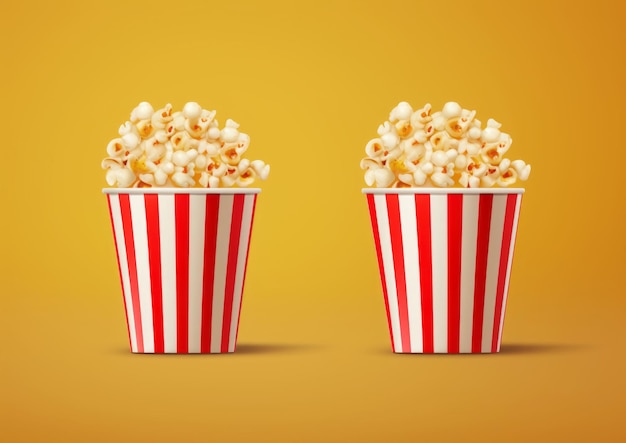 Due secchi a righe colorate pieni di deliziosi popcorn