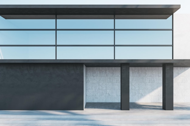 Edificio moderno illuminato dal sole con finestre ad effetto specchio in cima e parte vuota di muro di cemento scuro con spazio per cartelloni pubblicitari all'aperto rendering 3D mockup