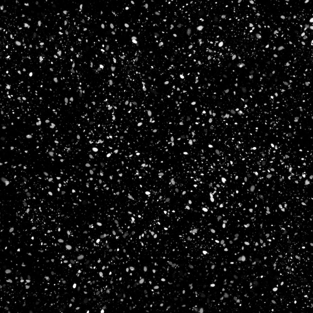 Effetto texture neve bianca naturale isolata su sfondo nero notte