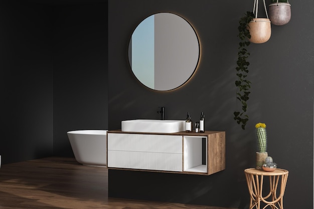 Elegante bagno interno scuro con pareti nere lavabo bianco con vasca da bagno a specchio ovale piante doccia e pavimento in parquet scuro Bagno accogliente minimalista con mobili moderni rendering 3D