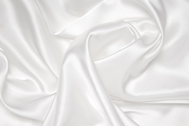 Elegante seta bianca liscia o satinata tessuto di stoffa di lusso può essere utilizzato come sfondo di matrimonio design di sfondo di lusso