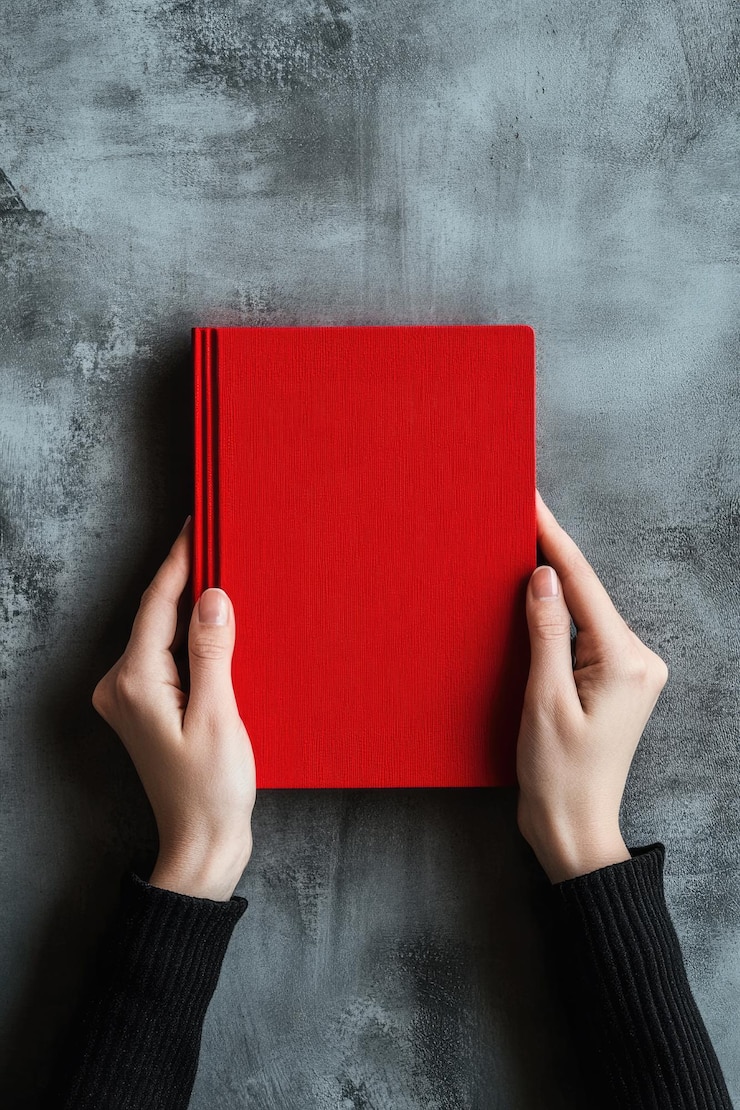 Photo employee handbook template female holding red book cover on grey background top view