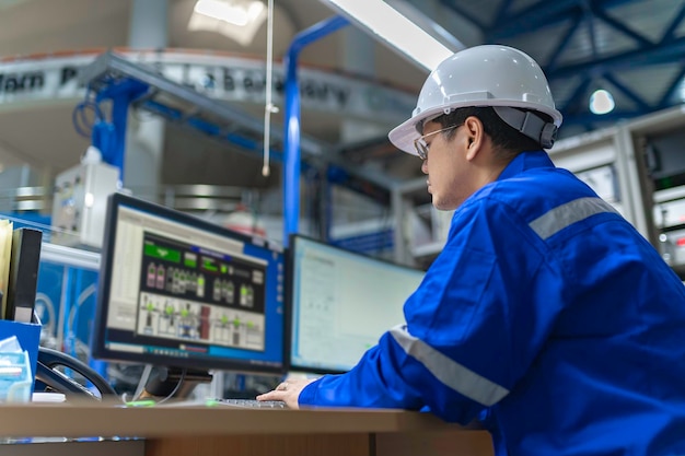 Engineer working at control roomManager control systemTechnician man monitoring program from a lot of monitor