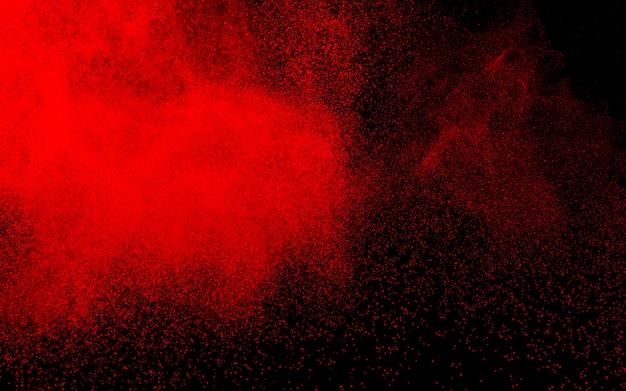 Esplosione di polvere di polvere rossa astratta su sfondo nero.