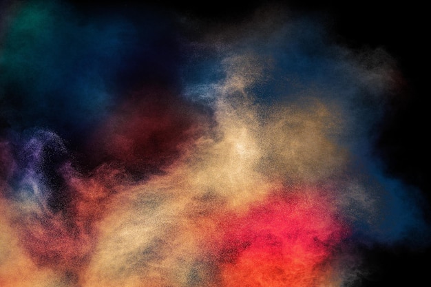 Esplosione di polvere Holi colorata su sfondo nero Particelle di polvere dai colori vivaci testurizzati