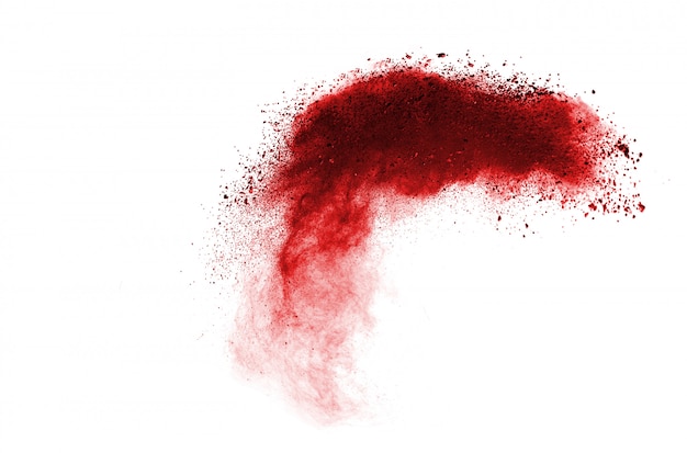 Esplosione di polvere rossa su sfondo bianco