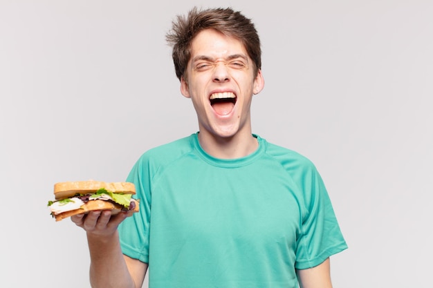 Espressione arrabbiata dell'uomo del giovane adolescente. concetto di dieta