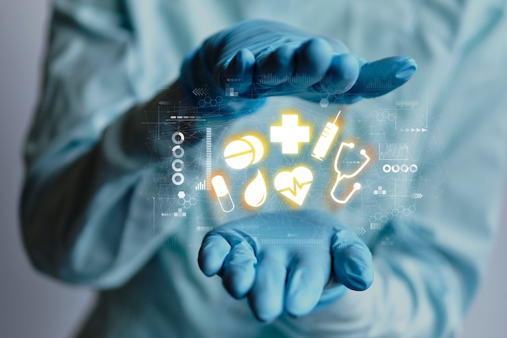 Foto estratto delle icone di concetto di sanità fra le mani di medico in guanti medici.