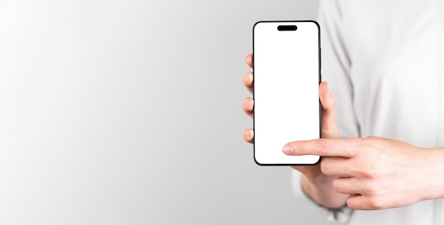 Facendo clic con la mano sul nuovo display dello smartphone mockup dello schermo del telefono cellulare mock up sullo sfondo del banner pubblicitario