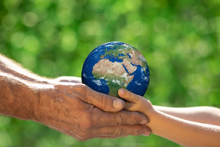 Foto famiglia che tiene pianeta 3d nelle mani. guanto di terra. salvare il nostro pianeta
