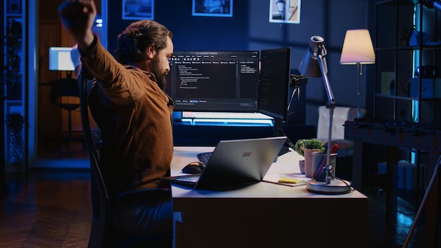 fatigued developer working overnight at home rubbing eyes while taking break