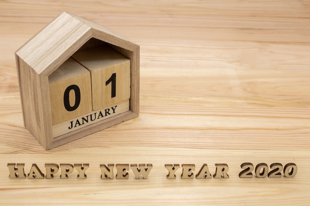 Felice anno nuovo 2020 e calendario casa in legno