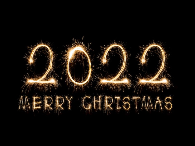 Felice Anno Nuovo 2022 Testo ardente scintillante Felice Anno Nuovo 2022 isolato su sfondo nero Beauti