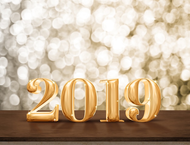 Felice anno nuovo oro 2019 lucido con stella scintillante sul tavolo