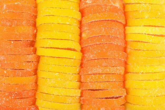 Fette di caramelle all'arancia e al limone come trama di sfondo