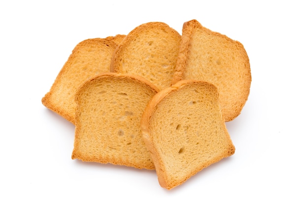 Fette di pane tostato isolato su superficie bianca, vista dall'alto.