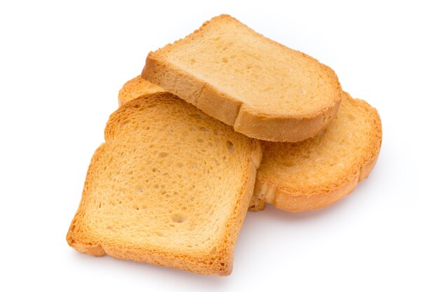 Fette di pane tostato sulla tavola di legno