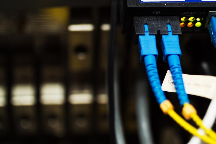 Photo fiber optic with servers in a technology data center