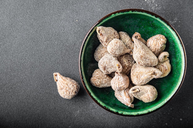 Fichi secchi frutta secca pasto sano spuntino alimentare sul tavolo spazio copia sfondo cibo rustico